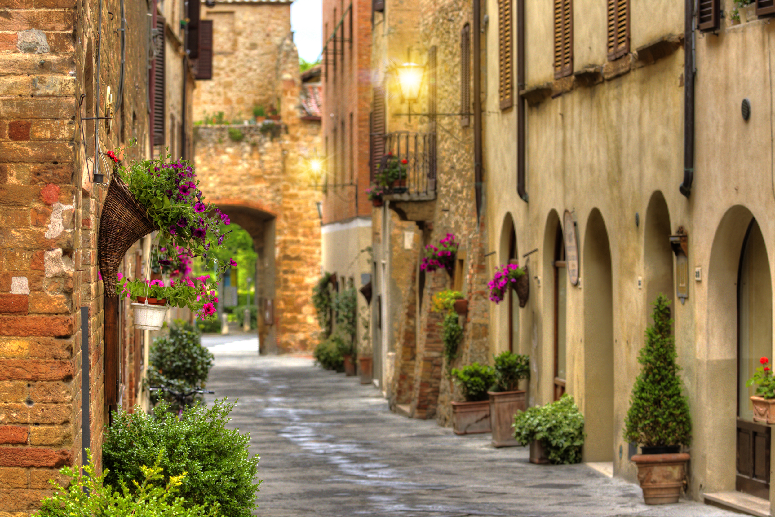 Flowery streets on a spring day in a old village Pienza